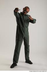 ERIC STANDING POSE WITH GUNS